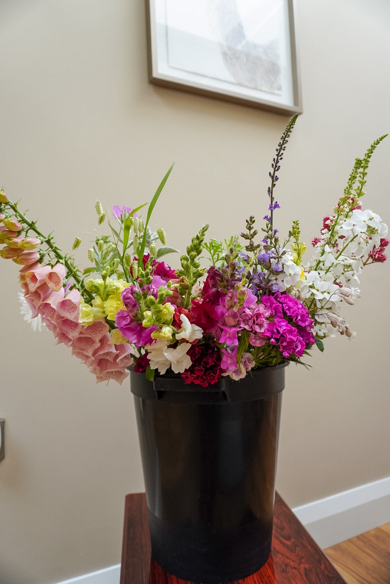 Flower bucket assortment containing flowers and foliage grown in Naas