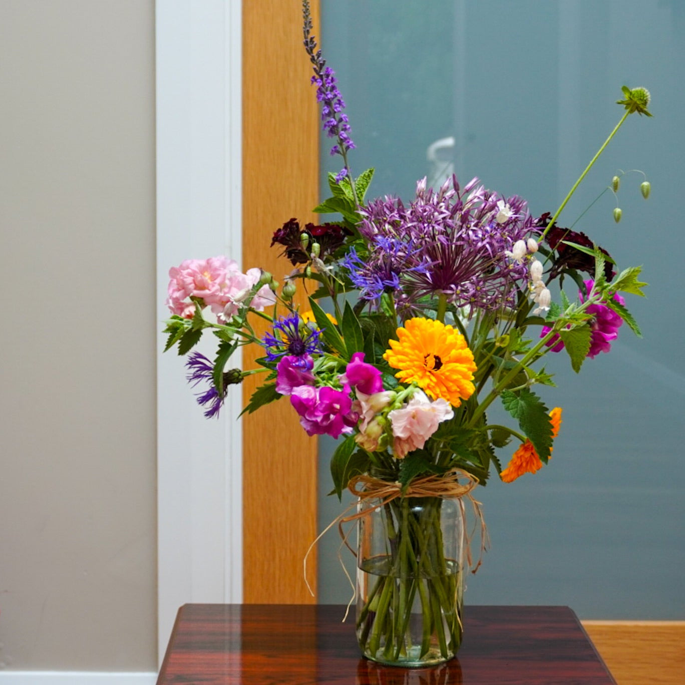 Bouquet of seasonal flowers grown in Naas. This arrangement is sold in a jar.